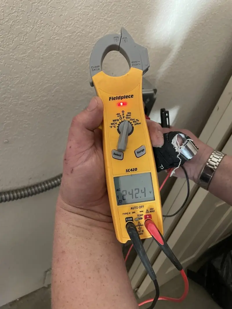 Voltage testing with clamp meter during Aluminum Wiring Replacement in Newport
